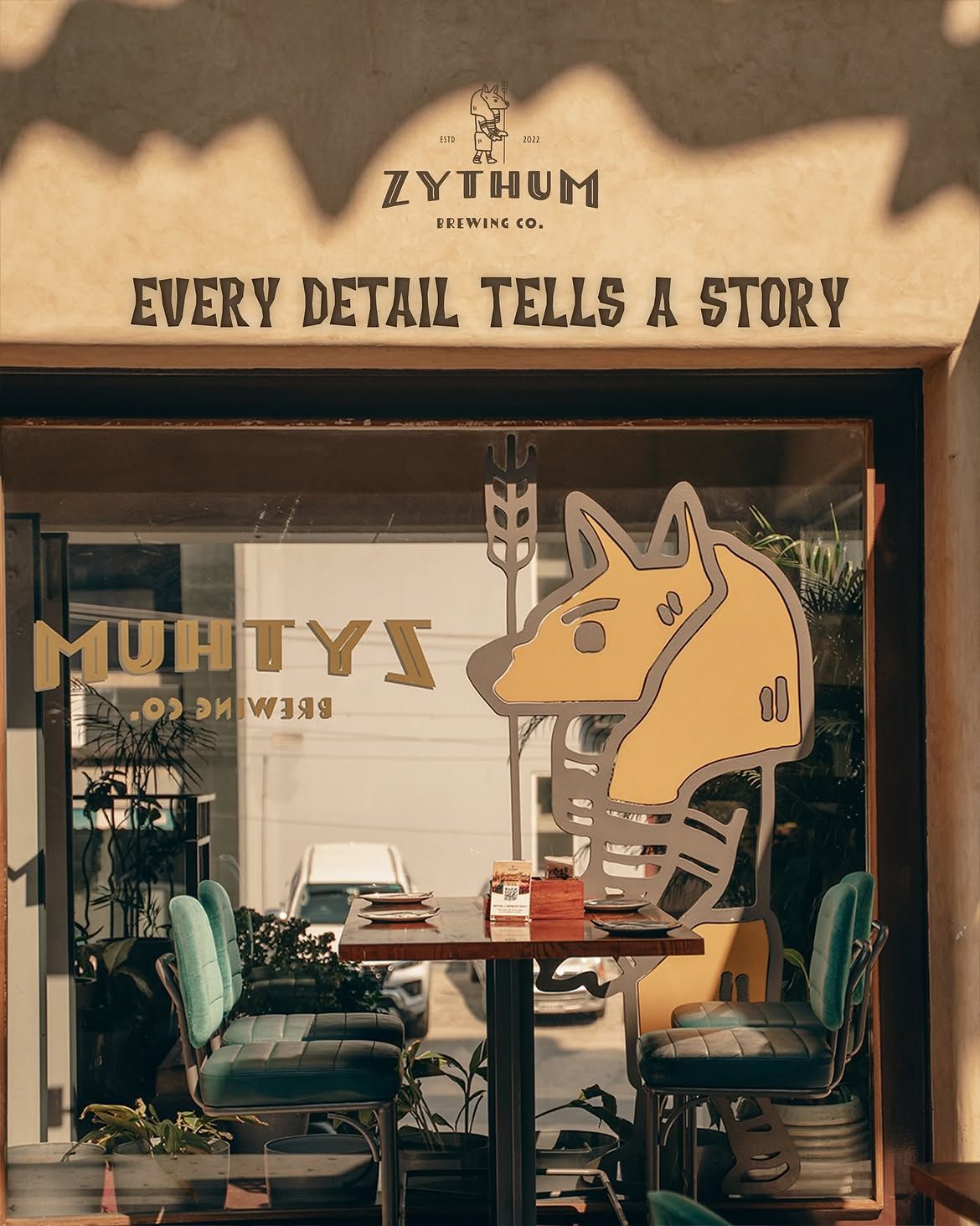 Sign inside Zythum reading Every detail tells a story, with the Anubis mascot