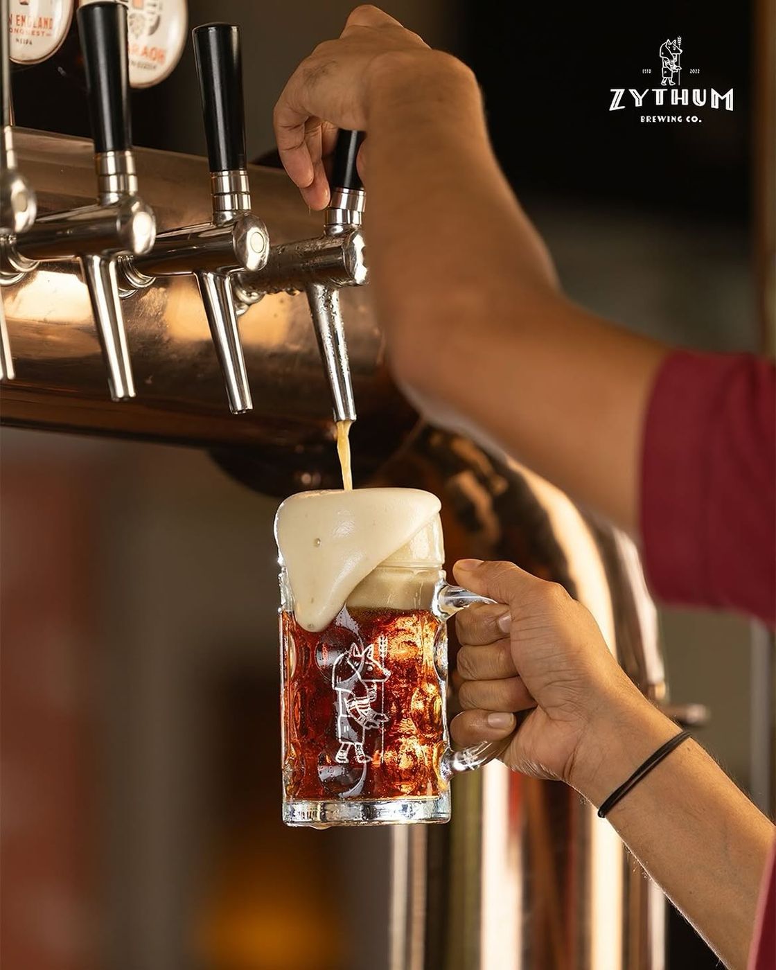 Pouring a beer at the taps